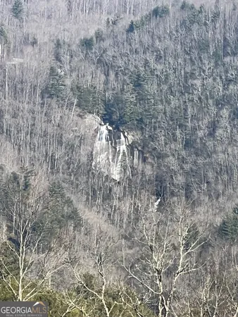a view of mountain view with trees