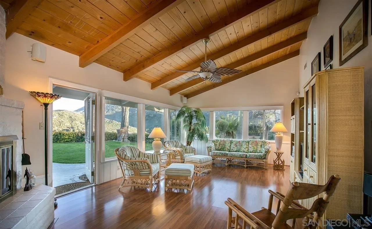 27303 Cool Water Ranch Road Valley Center, CA 92082 - Photo 12 of 30 a view of a dining room with furniture window and wooden floor