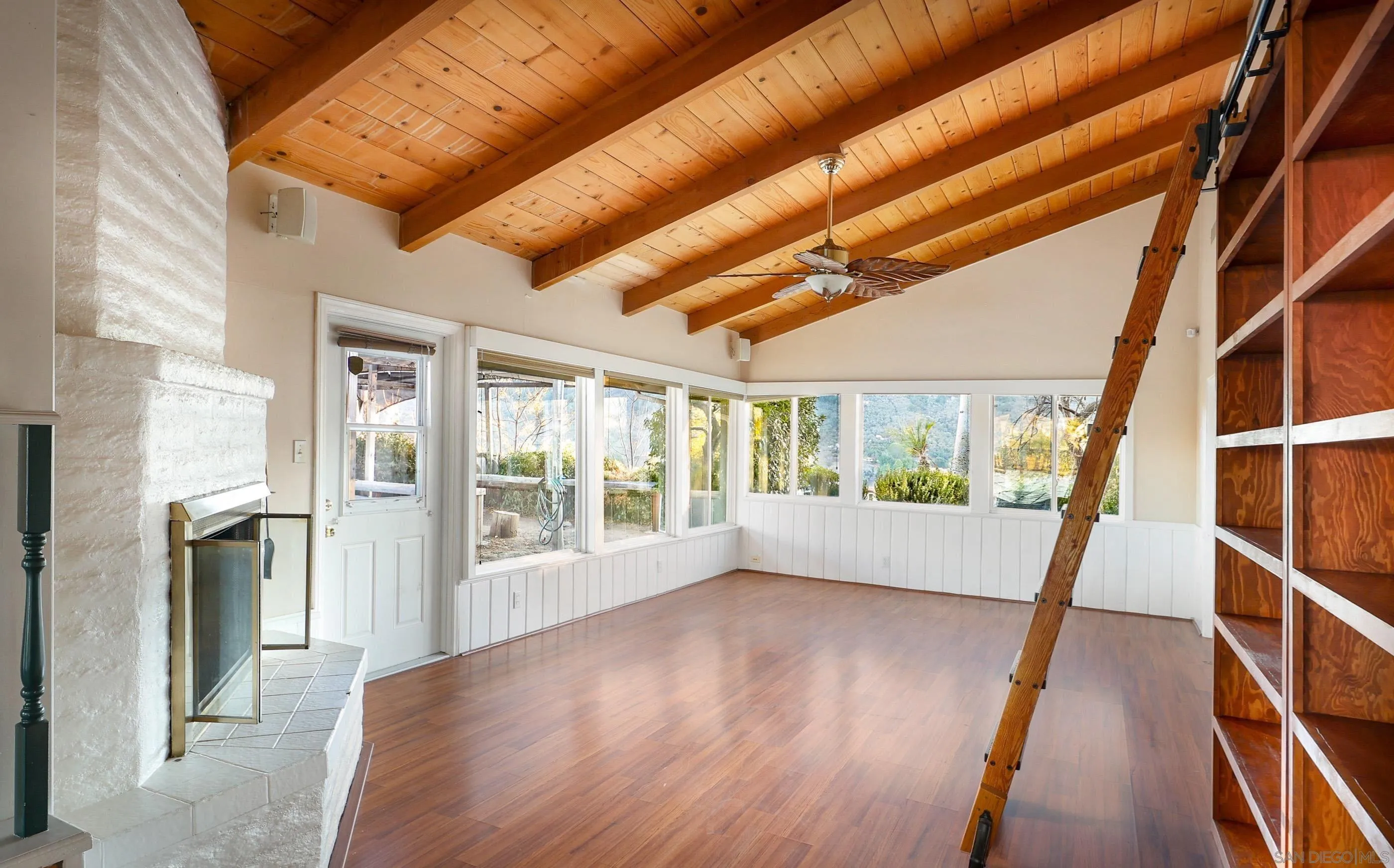 27303 Cool Water Ranch Road Valley Center, CA 92082 - Photo 13 of 30 a view of empty room with wooden floor and fan