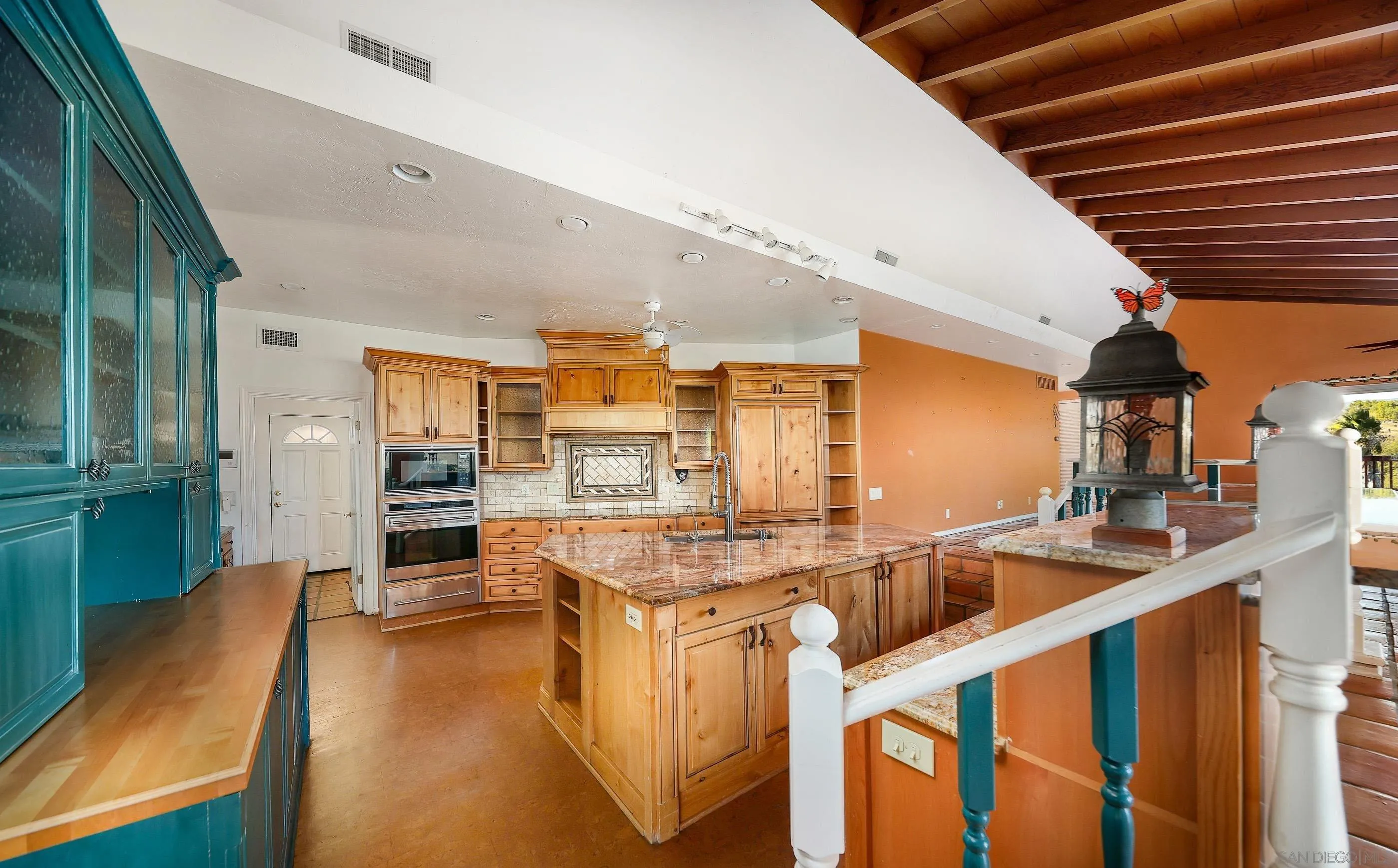 27303 Cool Water Ranch Road Valley Center, CA 92082 - Photo 16 of 30 a kitchen with counter top space and cabinets