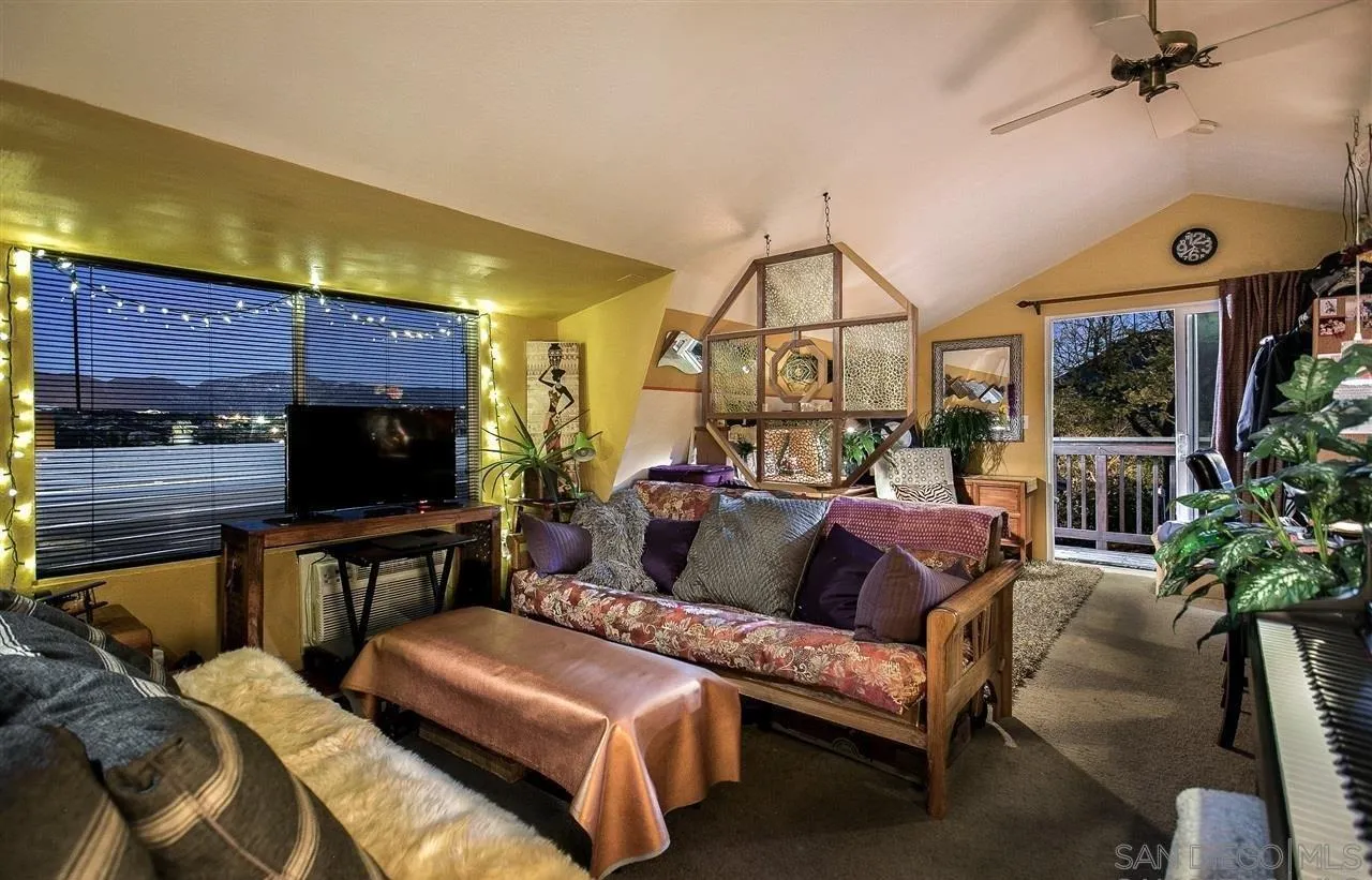 27303 Cool Water Ranch Road Valley Center, CA 92082 - Photo 25 of 30 a living room with furniture and a flat screen tv