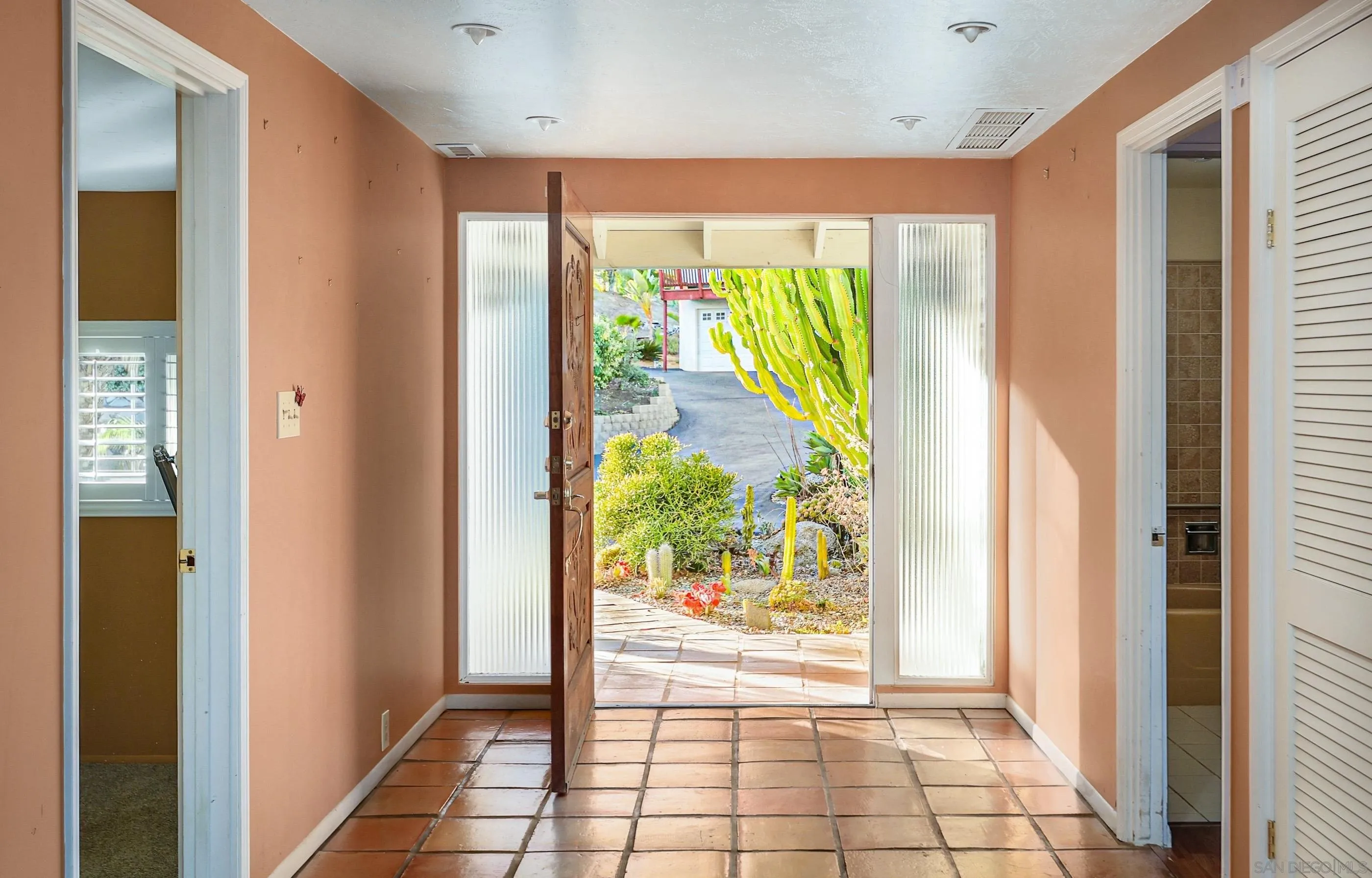 27303 Cool Water Ranch Road Valley Center, CA 92082 - Photo 3 of 30 a view of an entryway with wooden floor and a outdoor space
