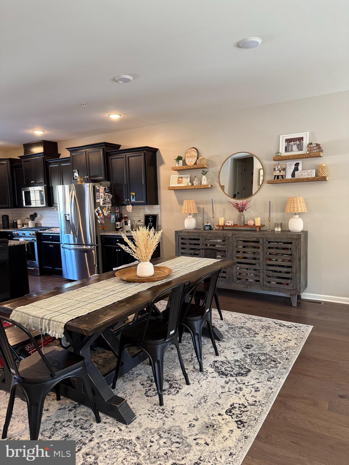 31 Par Lane Downingtown, PA 19335 - Photo 13 of 37 a living room with furniture a flat screen tv and kitchen view