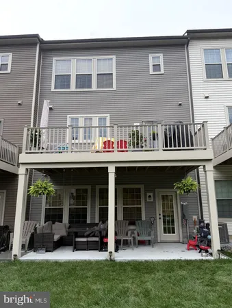 a front view of a house with porch and garden