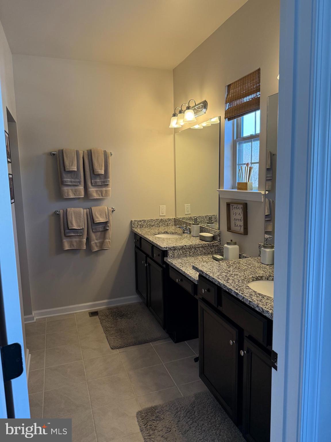 31 Par Lane Downingtown, PA 19335 - Photo 28 of 37 a bathroom with a granite countertop sink and a mirror