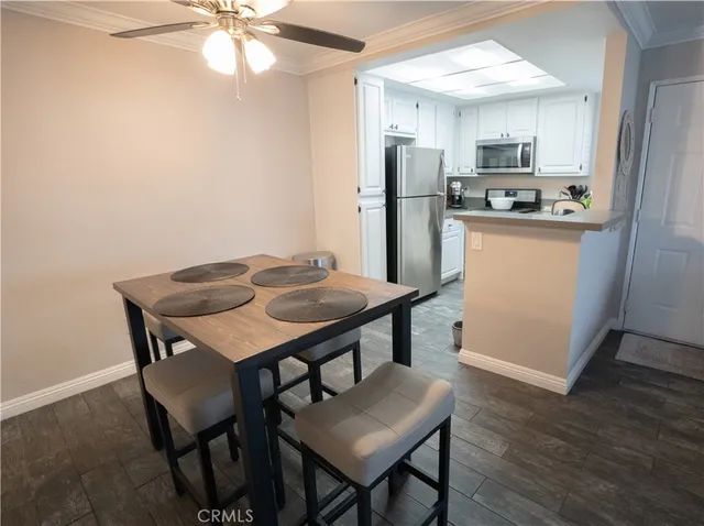 a kitchen with a table and chairs in it