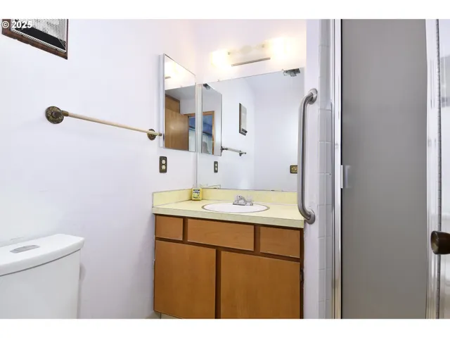 a view of an empty room with wooden door