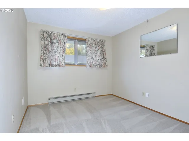 a bathroom with a sink a toilet a mirror a bathtub and shower