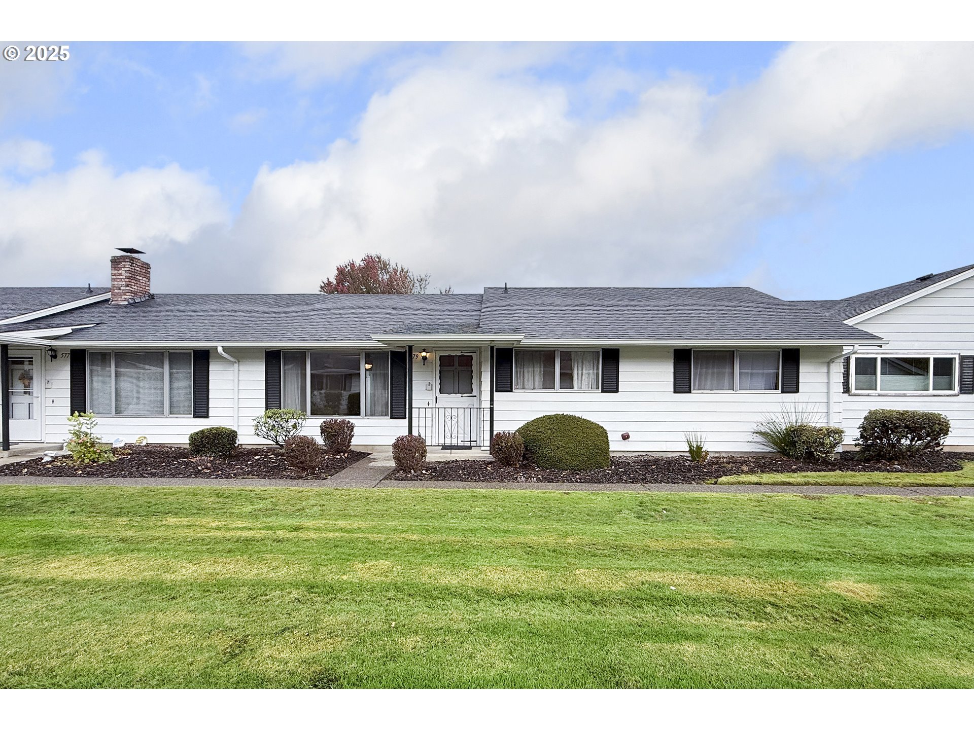 579 Northeast Fleming Avenue, Unit C41 Gresham, OR 97030 - Photo 24 of 32 a front view of a house with a yard