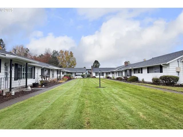 a kitchen with refrigerator cabinets and a sink