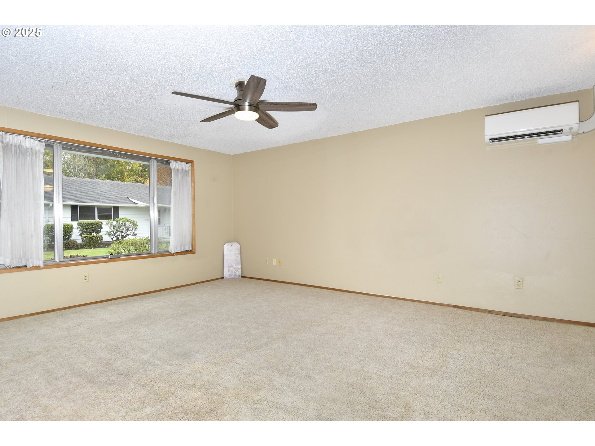 579 Northeast Fleming Avenue, Unit C41 Gresham, OR 97030 - Photo 3 of 32 a view of an empty room with a window