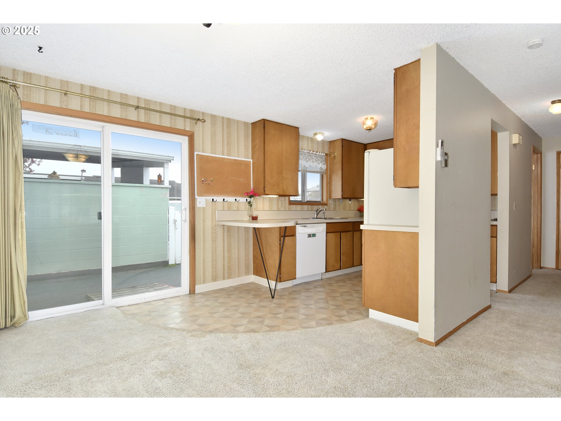579 Northeast Fleming Avenue, Unit C41 Gresham, OR 97030 - Photo 6 of 32 a kitchen with stainless steel appliances kitchen island granite countertop a refrigerator and a sink