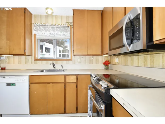 a kitchen with a sink and a refrigerator