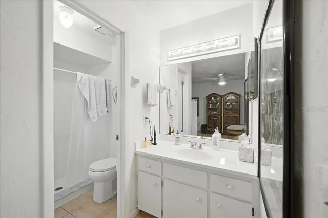 a bathroom with a toilet sink and shower