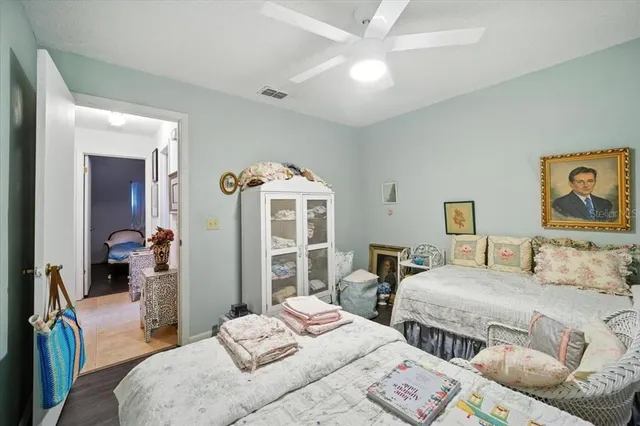 a bedroom with two beds and a window