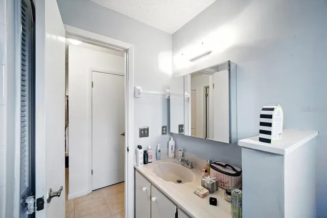 a bathroom with a sink a vanity and a mirror