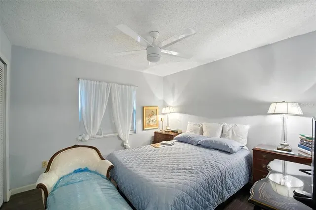 a bedroom with bed and a window