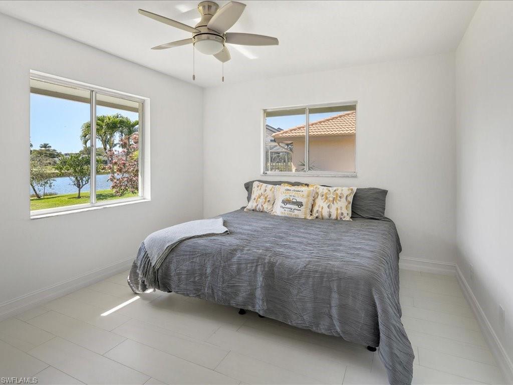 262 Torrey Pines Point Naples, FL 34113 - Photo 16 of 24 a bedroom with a bed and window