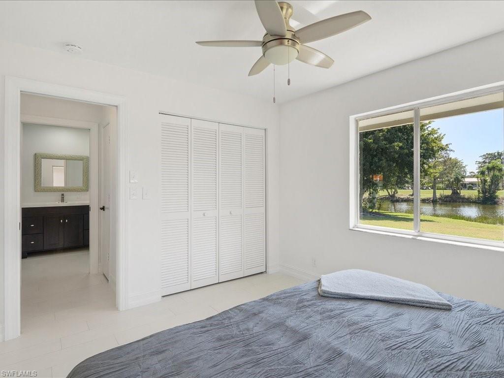 262 Torrey Pines Point Naples, FL 34113 - Photo 17 of 24 a view of an empty room with a window and kitchen view