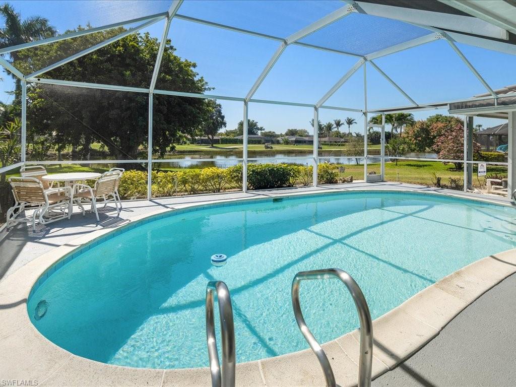 262 Torrey Pines Point Naples, FL 34113 - Photo 22 of 24 a view of a swimming pool with a porch