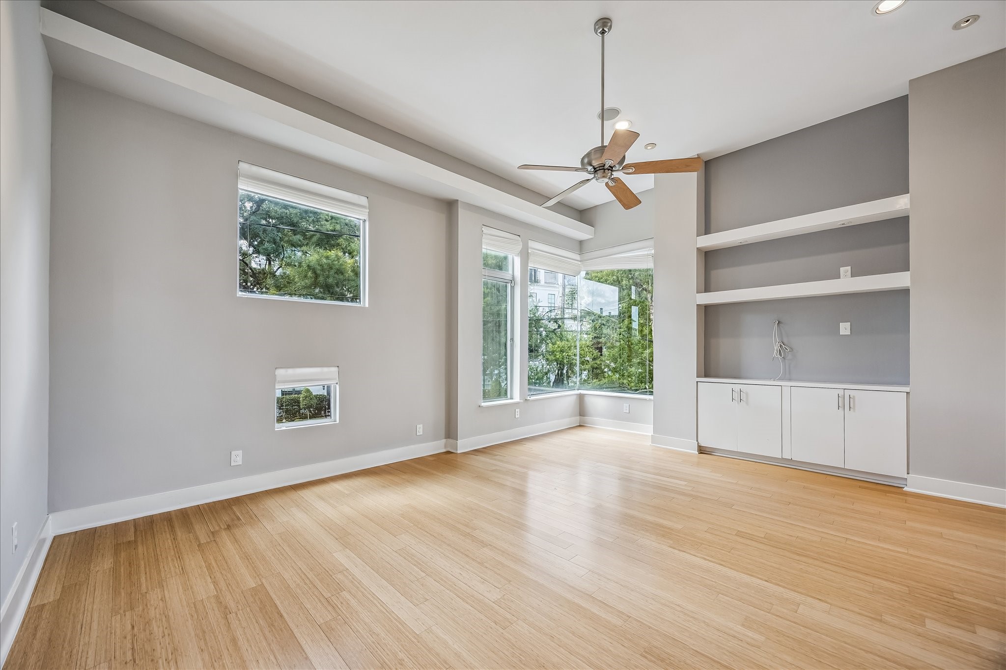 1610 Calumet Street Houston, TX 77004 - Photo 3 of 36 a view of an empty room with a window and wooden floor