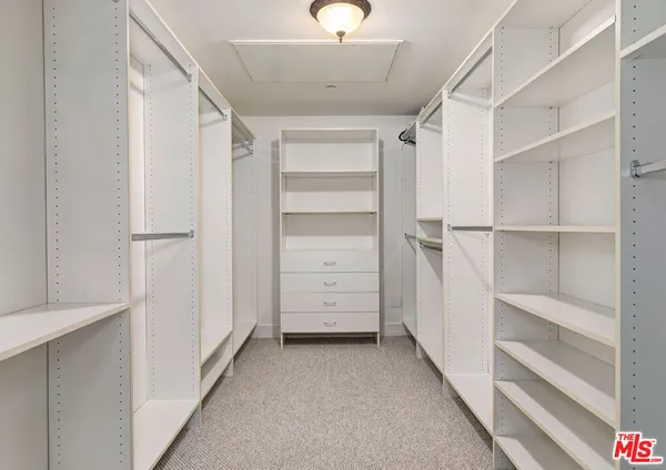 a view of an empty walk in closet