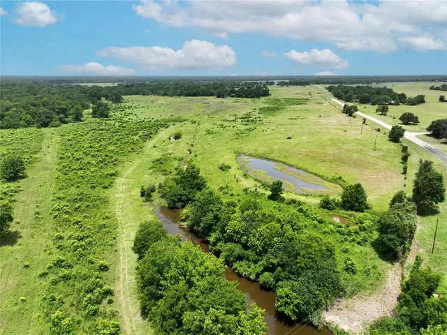 a view of a lake with a yard