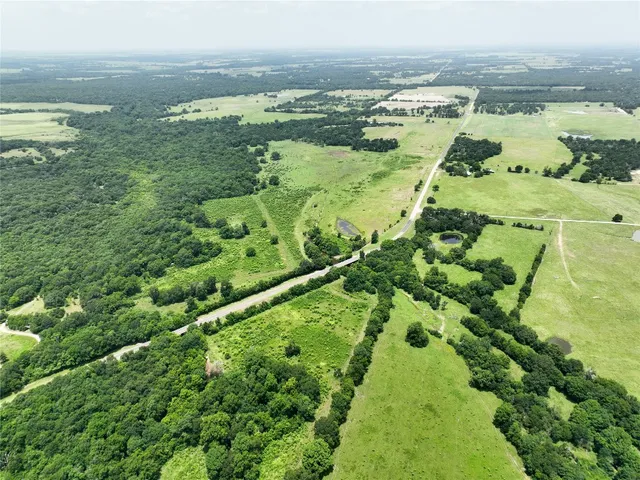 a view of a lake with a yard