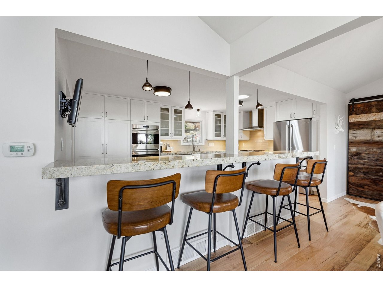 101 Canon View Road Boulder, CO 80302 - Photo 11 of 49 Plenty of bar seating for gathering, dining, and everyday living