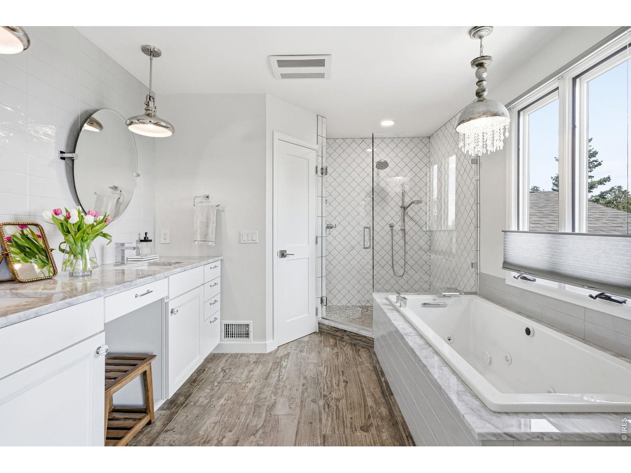 101 Canon View Road Boulder, CO 80302 - Photo 24 of 49 Sophisticated primary bathroom offering a spa-like experience. Customized shower, oversized jacquzzi tub and heated porcelain flooring