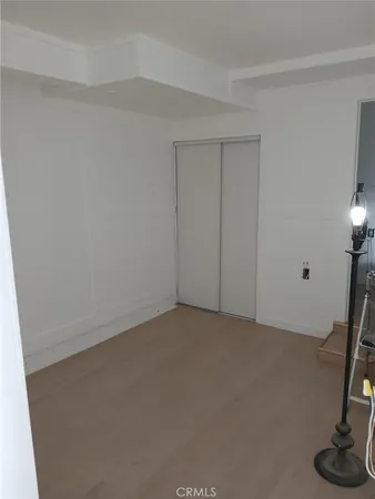a view of an empty room and a window