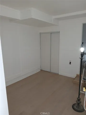 a view of an empty room and a window