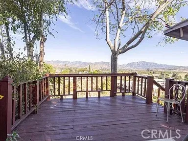 a view of outdoor space with seating yard and wooden fence