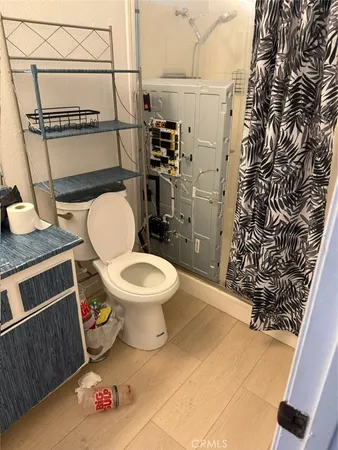 a white toilet sitting next to a bathroom sink