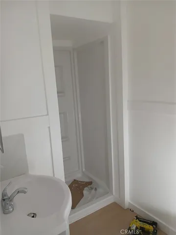 a bathroom with a tub and sink