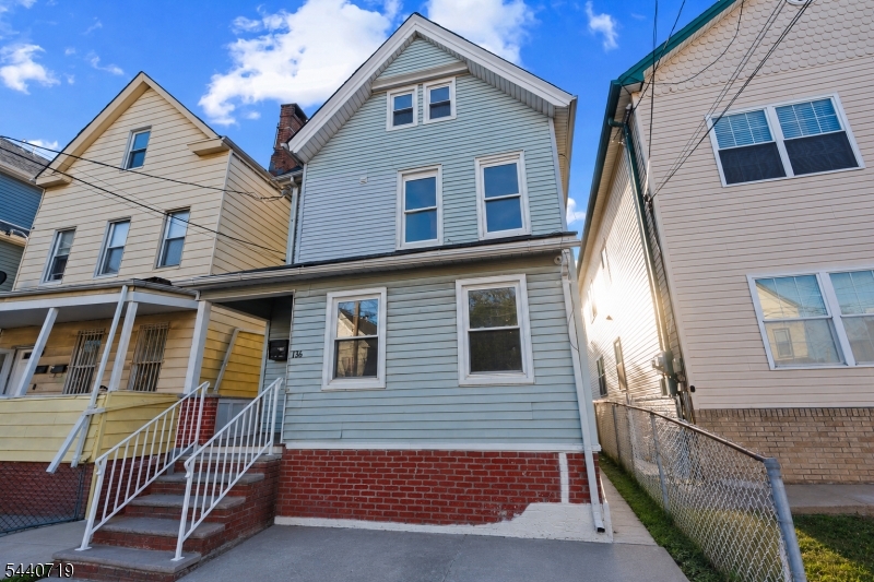 136 Smith Street Elizabeth, NJ 07201 - Photo 2 of 38 a view of a house with iron stairs