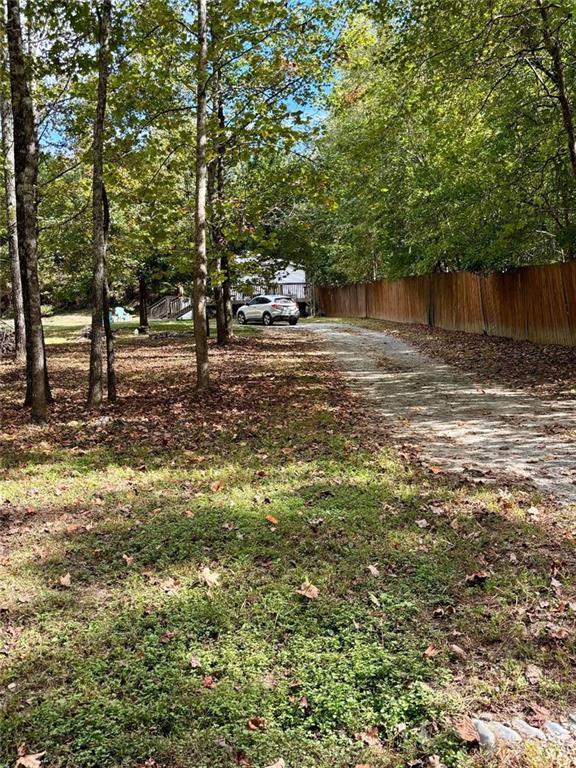 214 Hightower Street Acworth, GA 30102 - Photo 1 of 1 a backyard of a house with lots of green space