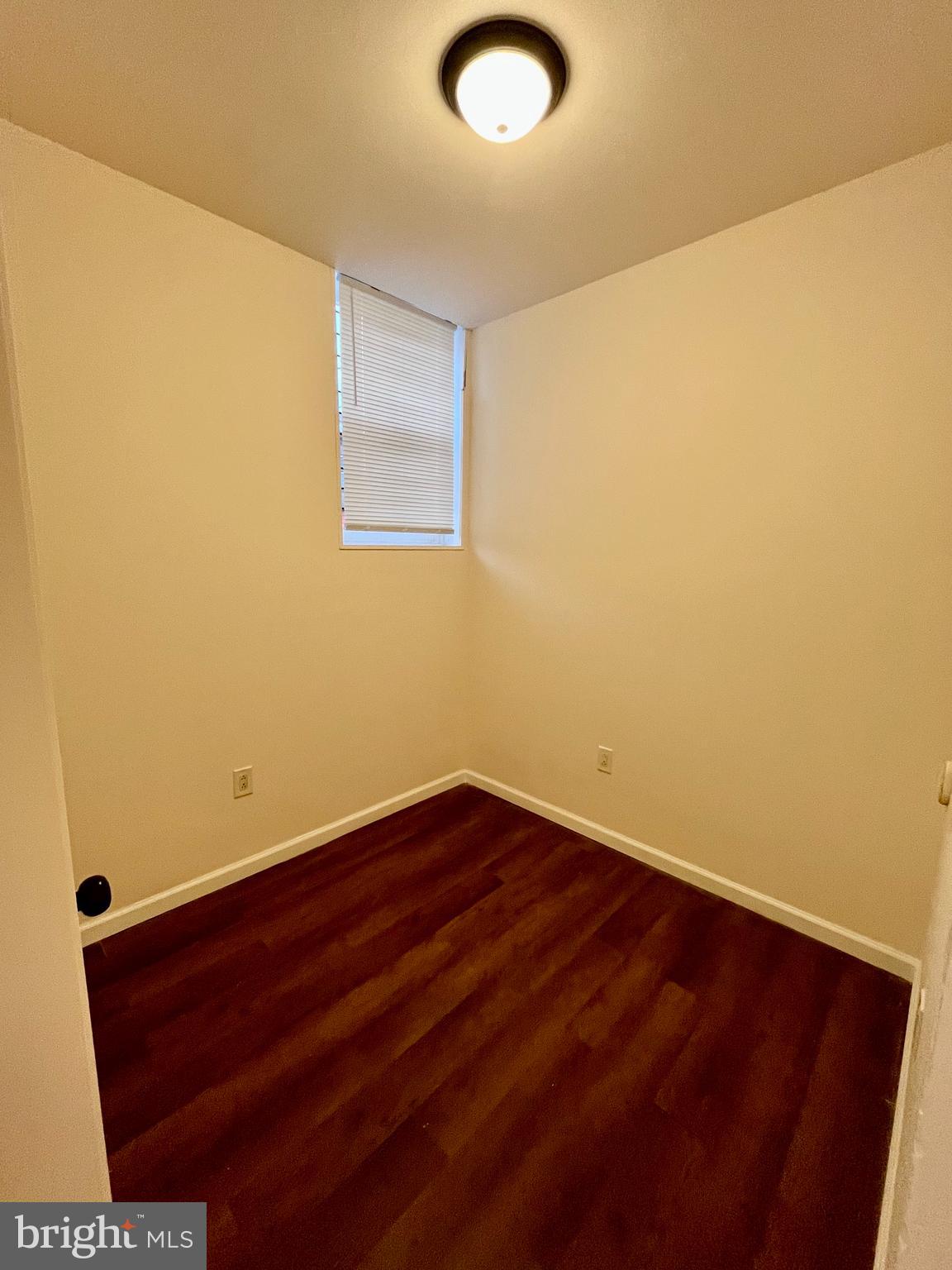 6249 Reedland Street, Unit 1M Philadelphia, PA 19142 - Photo 4 of 9 a view of empty room with wooden floor