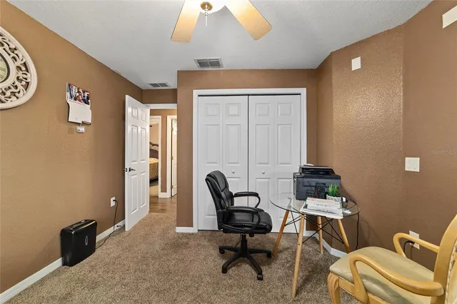 a view of a workspace with furniture