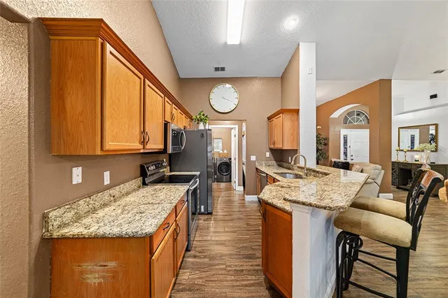 a living room with granite countertop furniture and a large window