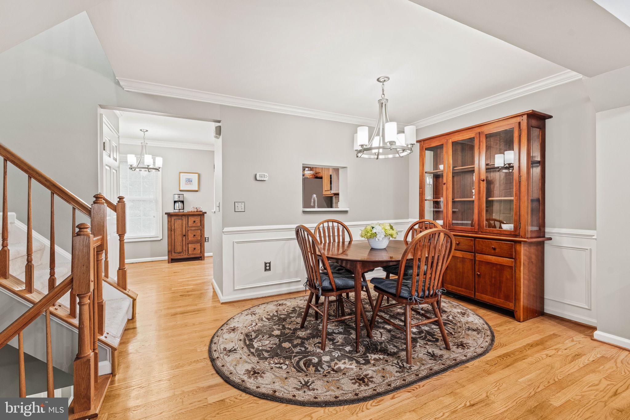 913 Rolfe Place Alexandria, VA 22314 - Photo 12 of 49 Crown molding, wainscoting embrace these rooms