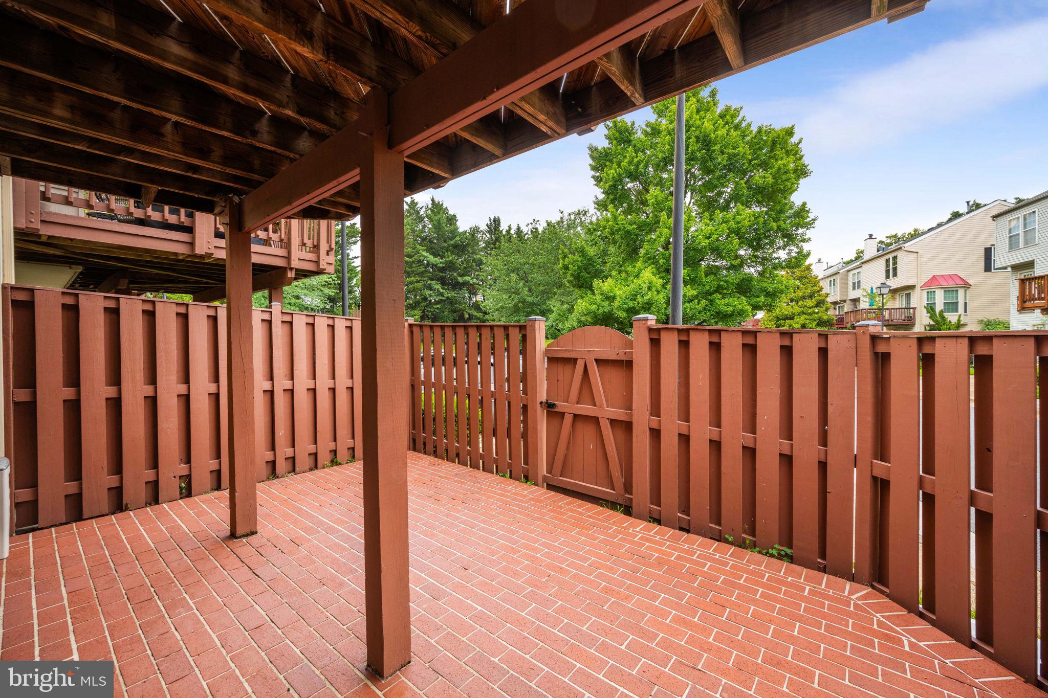 913 Rolfe Place Alexandria, VA 22314 - Photo 35 of 49 Through the gate is more parking and common area