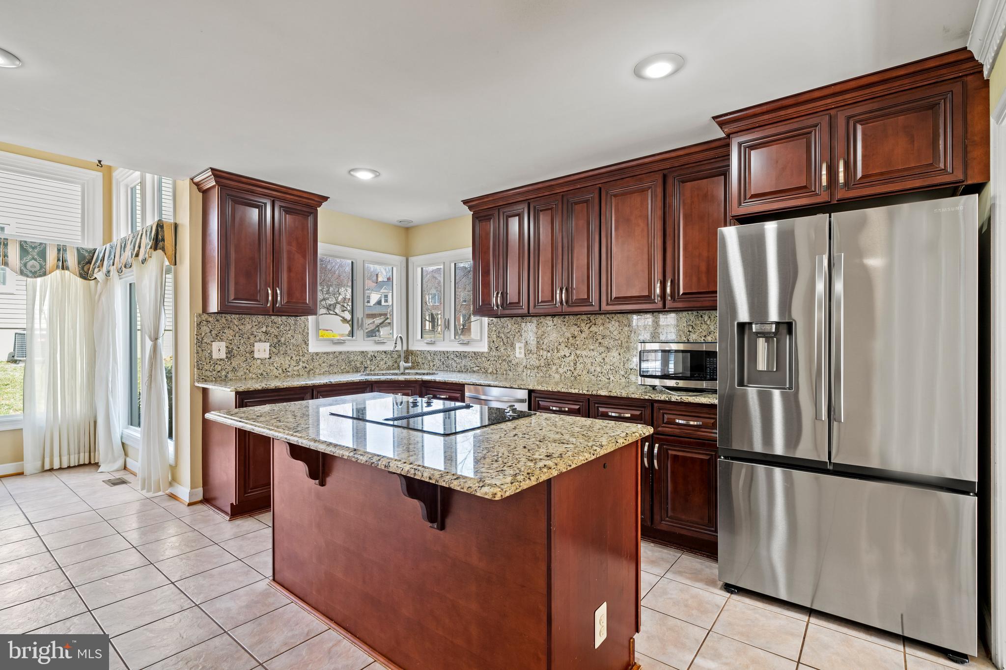 109 Englefield Drive Gaithersburg, MD 20878 - Photo 11 of 67 a kitchen with stainless steel appliances granite countertop a stove a refrigerator a sink and dishwasher