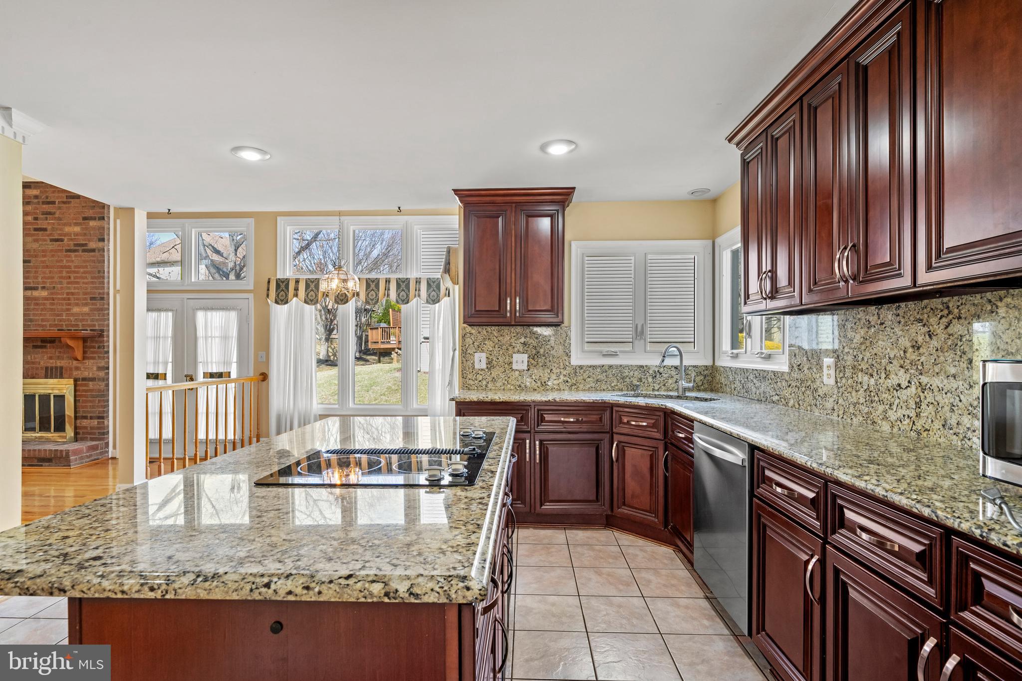 109 Englefield Drive Gaithersburg, MD 20878 - Photo 12 of 67 a kitchen with stainless steel appliances granite countertop a sink stove and cabinets