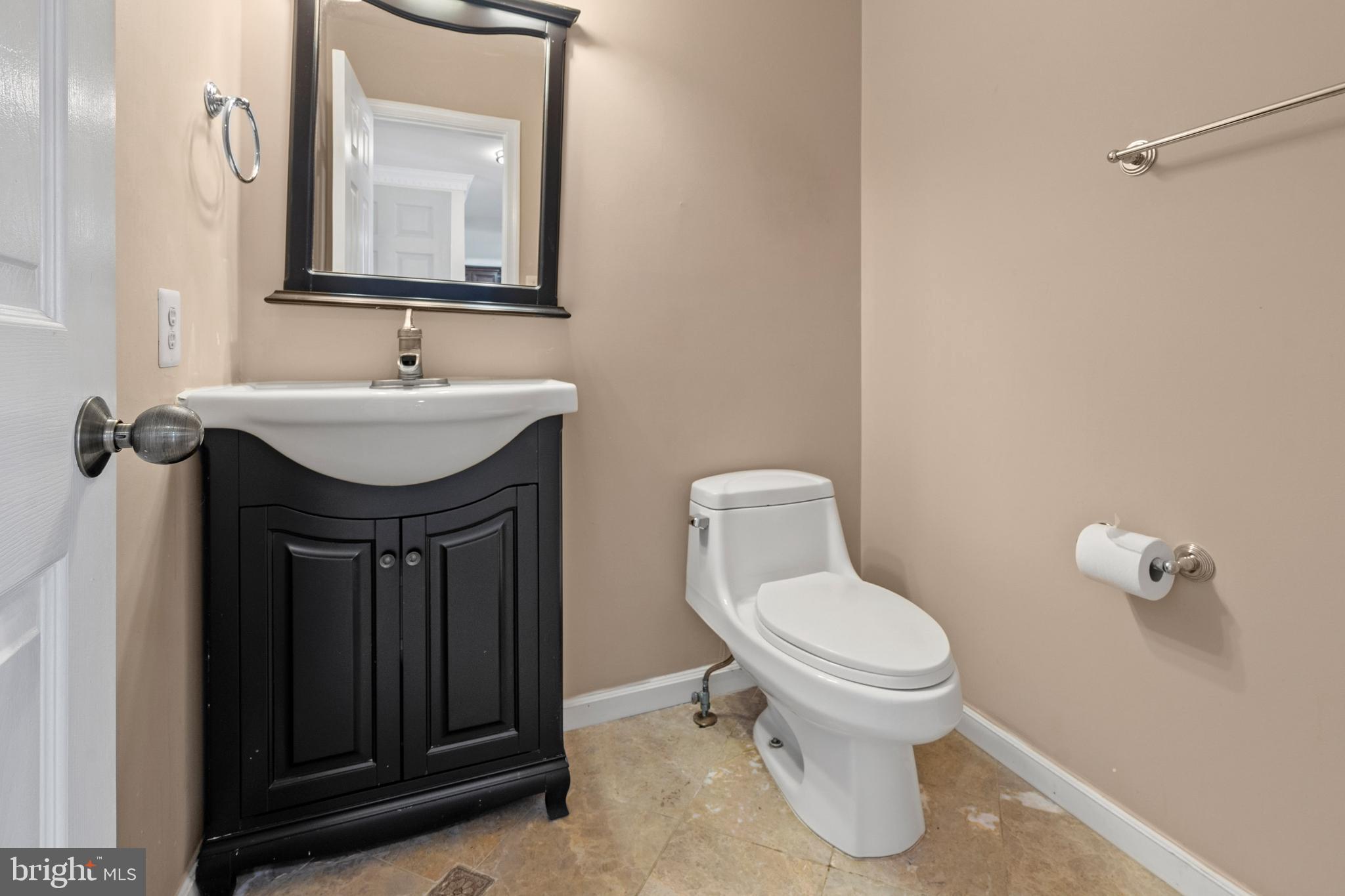 109 Englefield Drive Gaithersburg, MD 20878 - Photo 16 of 67 a bathroom with a toilet sink and mirror