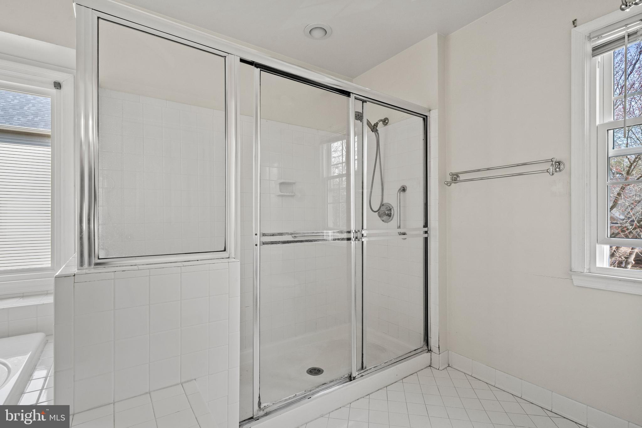 109 Englefield Drive Gaithersburg, MD 20878 - Photo 33 of 67 a bathroom with a glass shower door