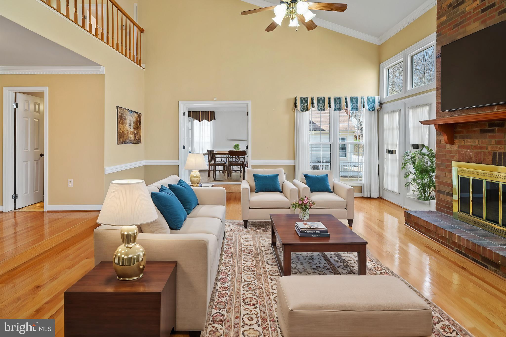 109 Englefield Drive Gaithersburg, MD 20878 - Photo 4 of 67 a living room with furniture a fireplace and a flat screen tv
