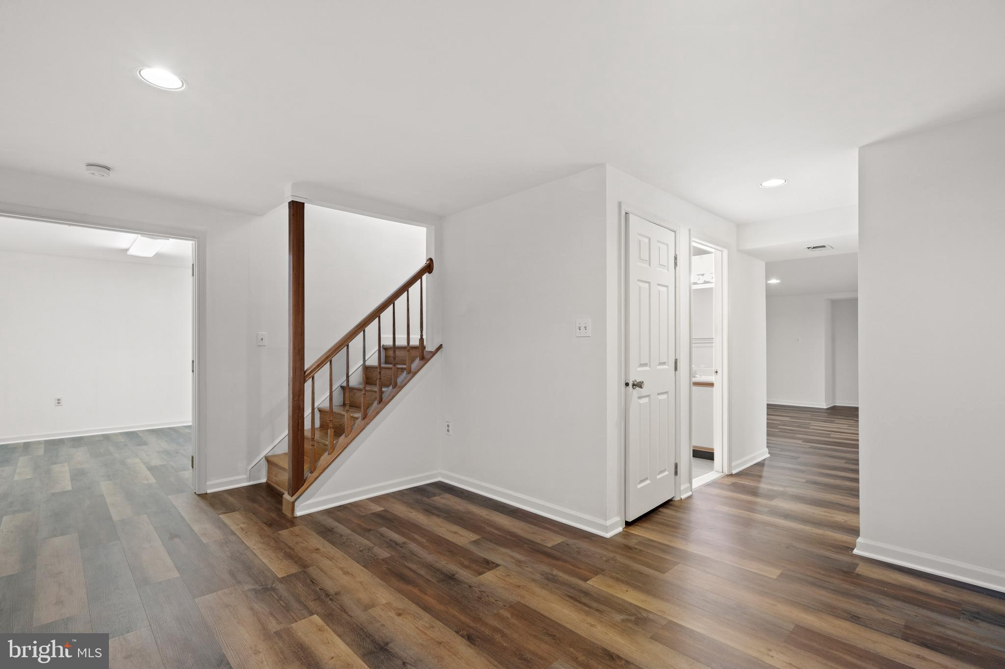 109 Englefield Drive Gaithersburg, MD 20878 - Photo 47 of 67 a view of a hallway with wooden floor and stairs