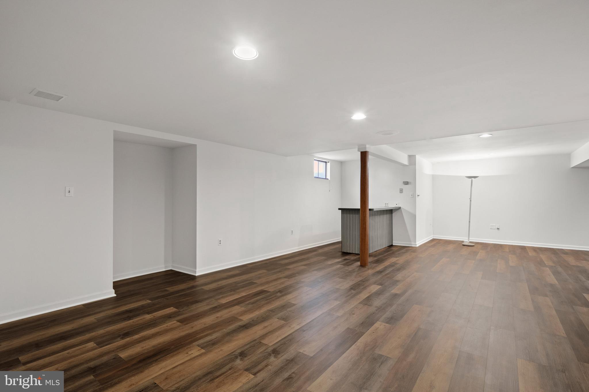 109 Englefield Drive Gaithersburg, MD 20878 - Photo 53 of 67 a view of an empty room with wooden floor