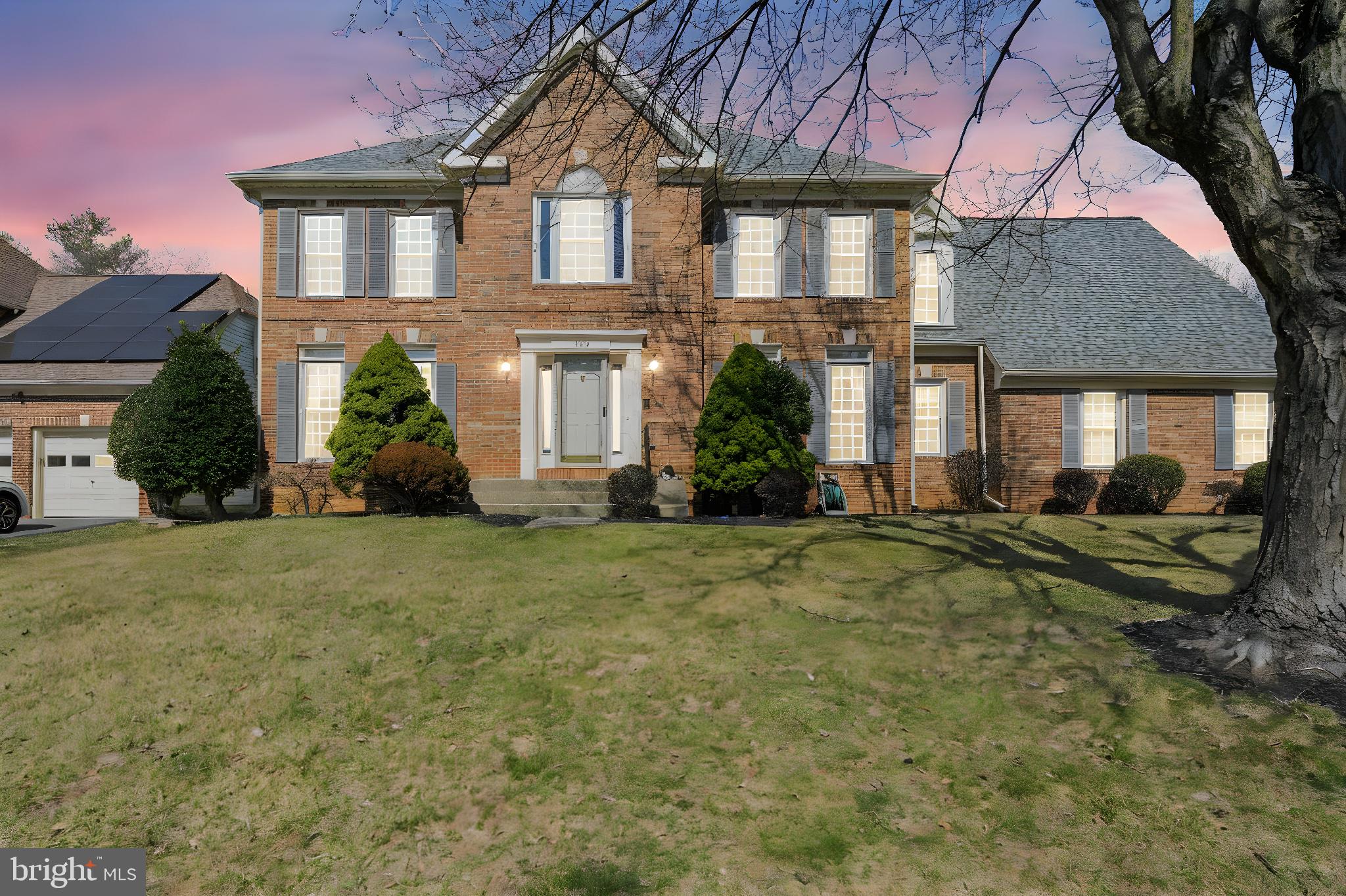 109 Englefield Drive Gaithersburg, MD 20878 - Photo 66 of 67 a front view of a house with a yard and potted plants